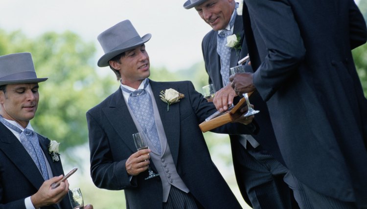 Groomsmen work together to ensure the wedding ceremony and reception proceed as planned.