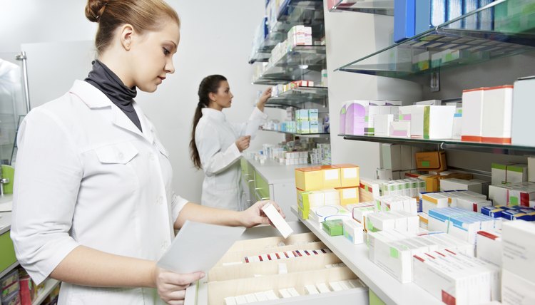 Pharmacy chemist women in drugstore