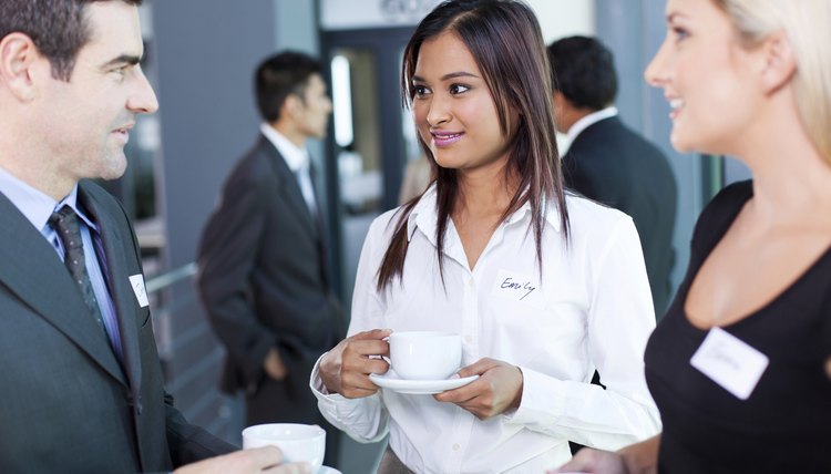 businesspeople interacting during conference coffee break