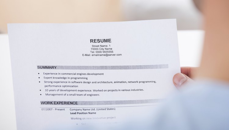 Person Holding Resume