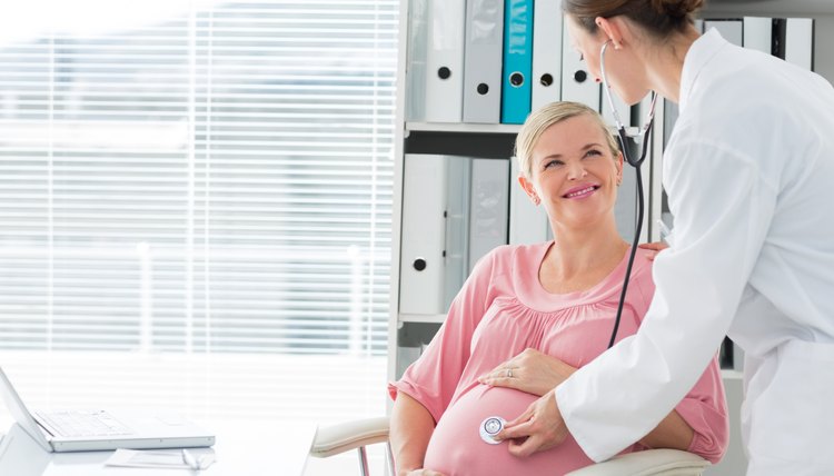Doctor examining pregnant woman