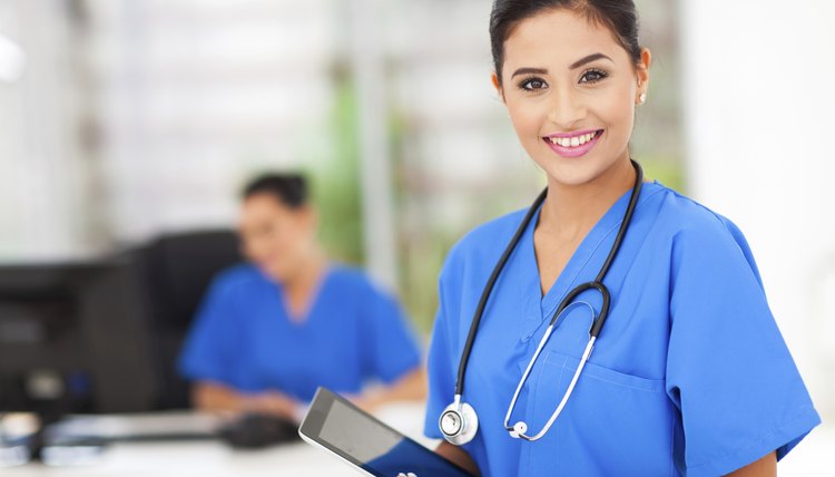 female nurse holding tablet computer