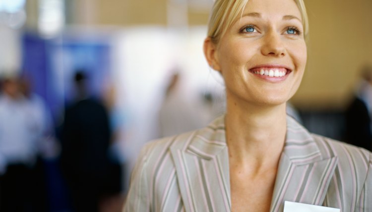 close-up of a businesswoman smiling at an exhibition