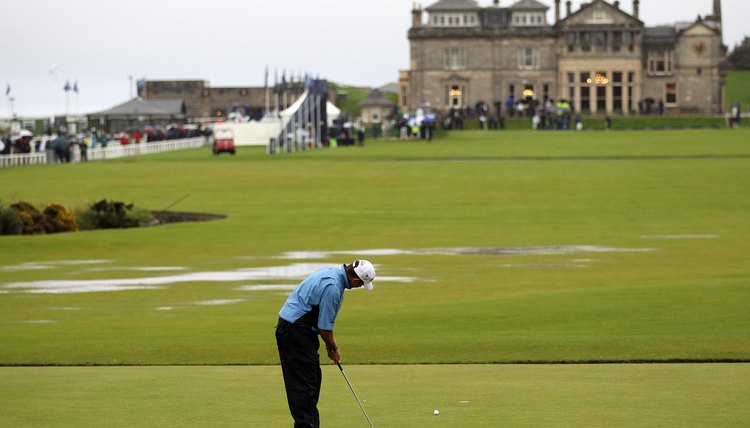 Lee Westwood putts on the first green of the Old Course at St. Andrews in 2011.