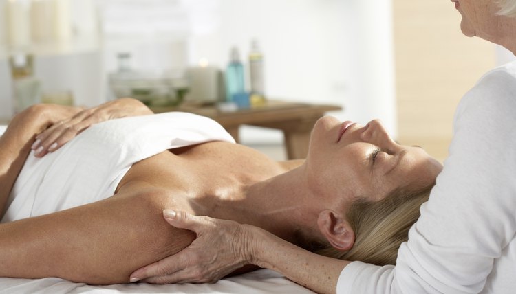 Woman laying on table having a massage