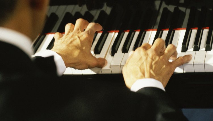 Rear view of a man playing the piano