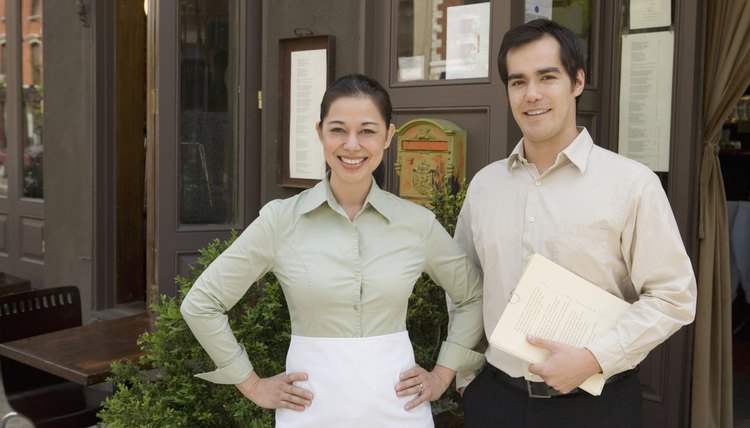 Waitress and Host Smiling Outside the Restaurant