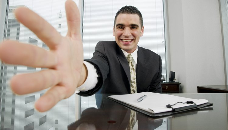 Close-up of businessman extending hand