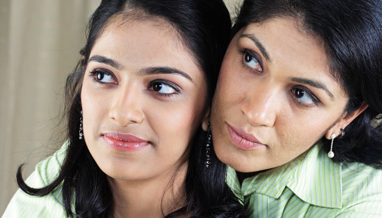 Close up of a mother embracing her daughter