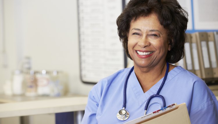 Female Nurse At Nurses Station