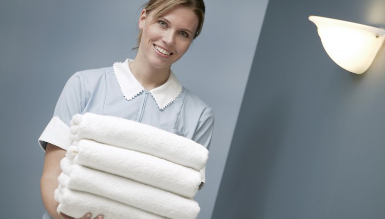 Maid holding towels