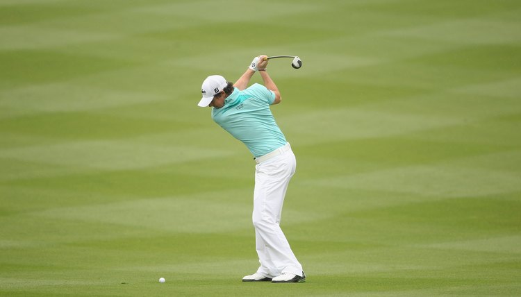 At the top of his backswing, McIlroy's back faces his target.