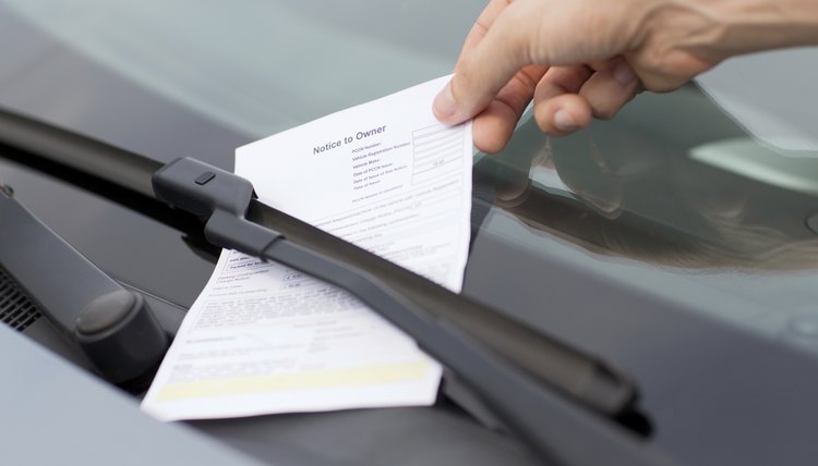 parking ticket on car windscreen