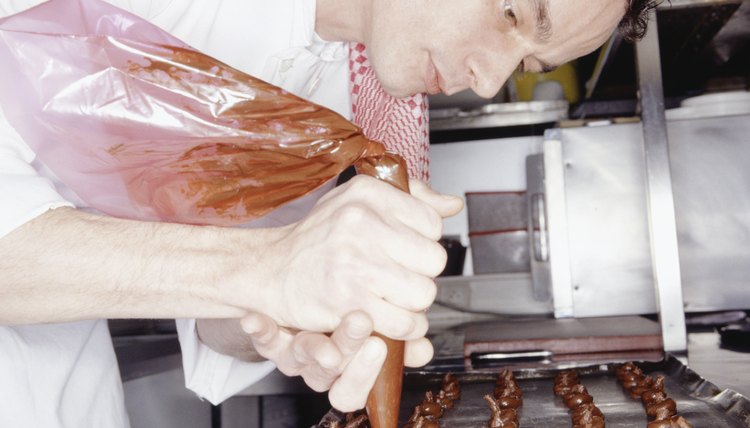 Chef making chocolates in kitchen