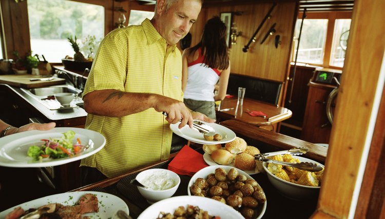 Guests bring varied dishes to a modern potluck dinner.