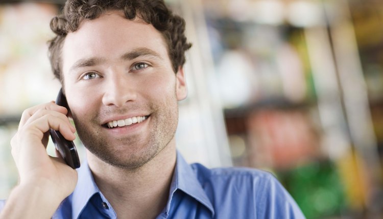 Man smiling on cell phone