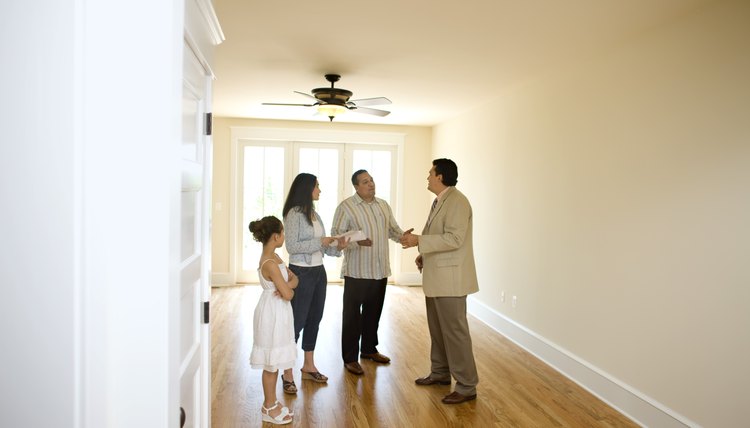 Family with realtor in new home