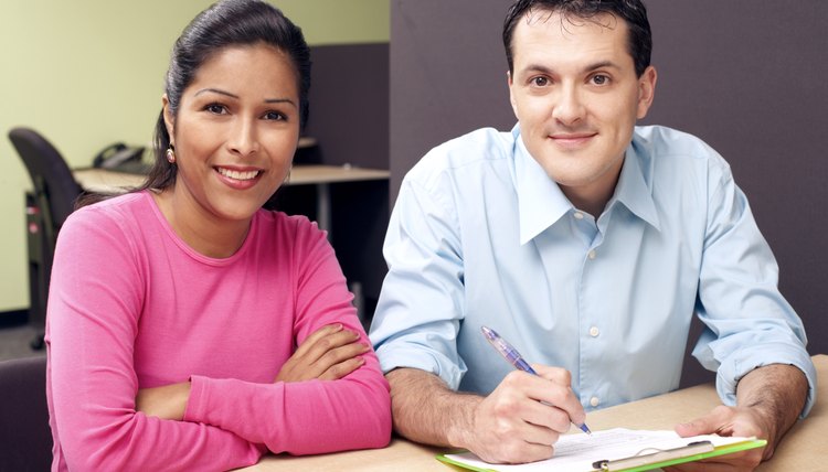Couple filling out paperwork