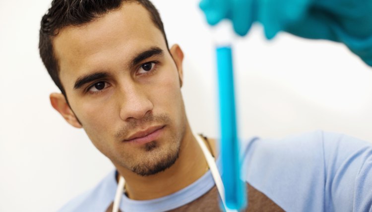 Students holding test tube in lab