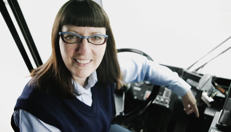 Bus driver at steering wheel