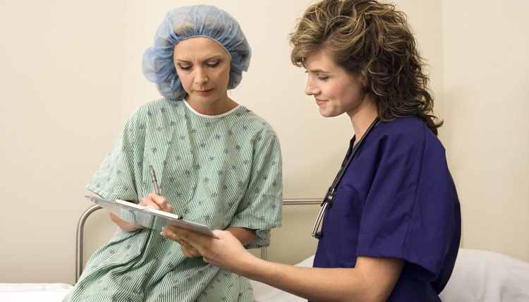 Nurse with patient signing consent form