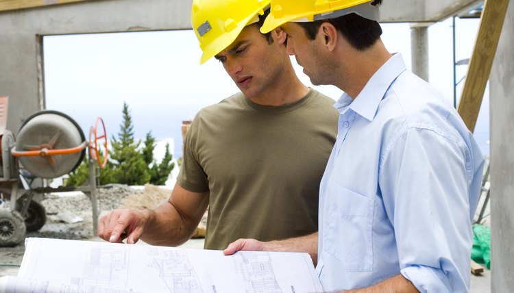 Workers with blueprints