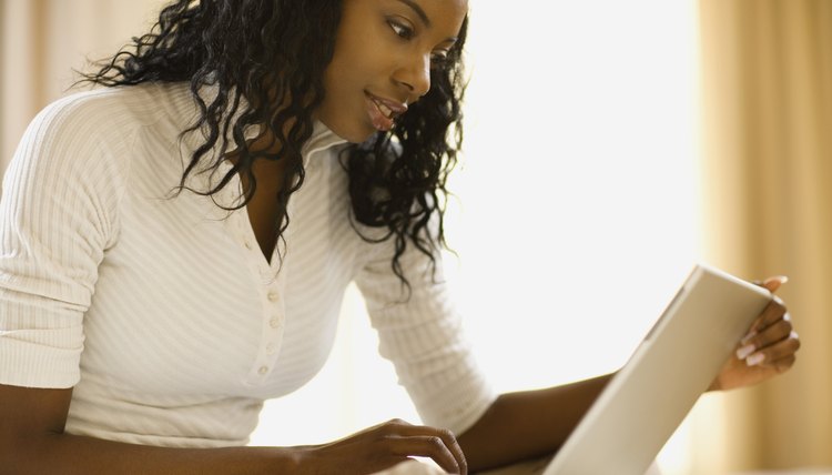 Woman working at home with laptop computer