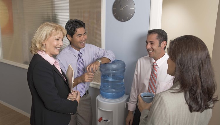 Businesspeople gathering at water cooler