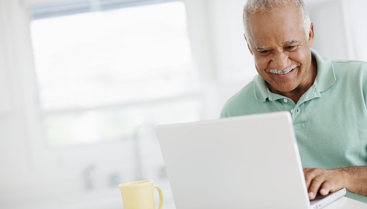 40 year old man looking at bank accounts online