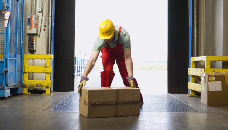 Warehouse worker lifting box