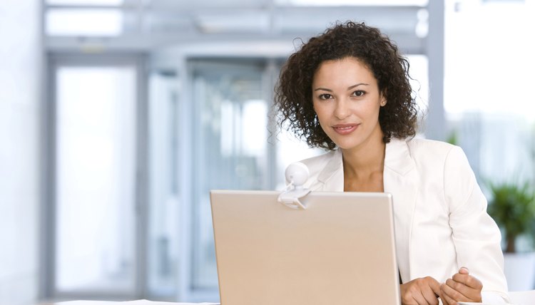 Smiling Businesswoman With Laptop