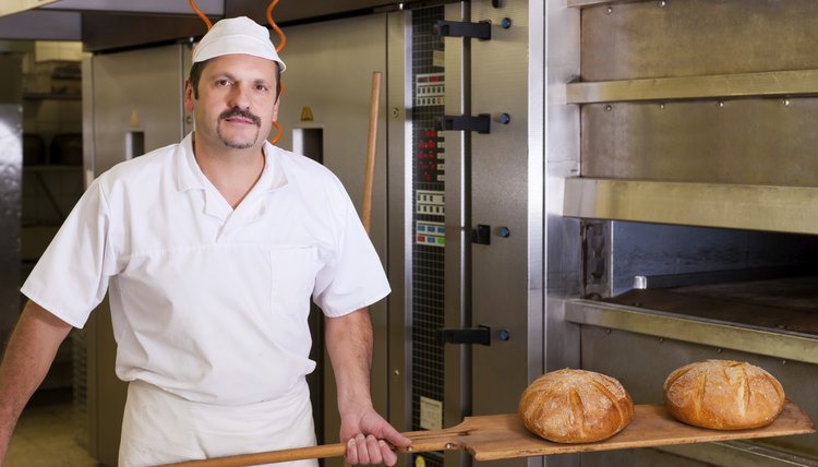 Male baker baking bread