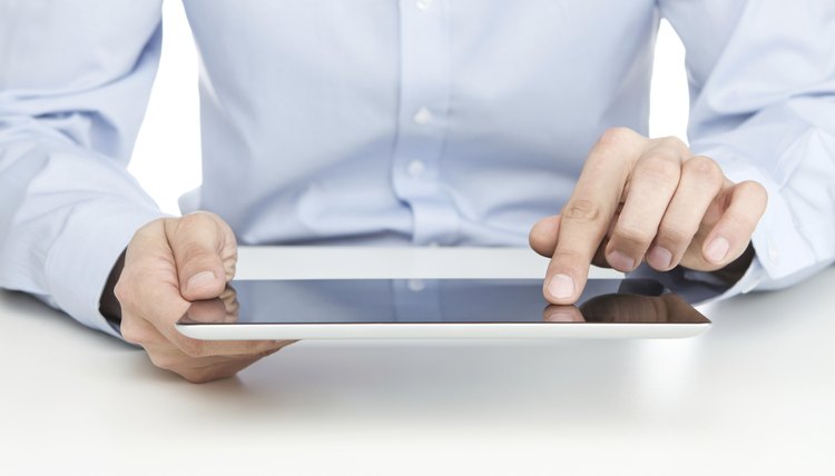 Young adult using digital tablet