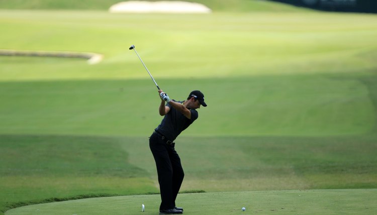 Schwartzel finishes his backswing by simply swinging his arms to the top.