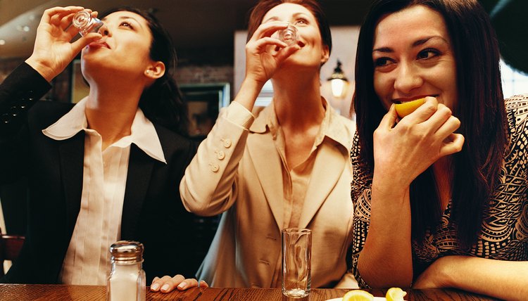 Businesswomen Drinking Tequila in a Bar