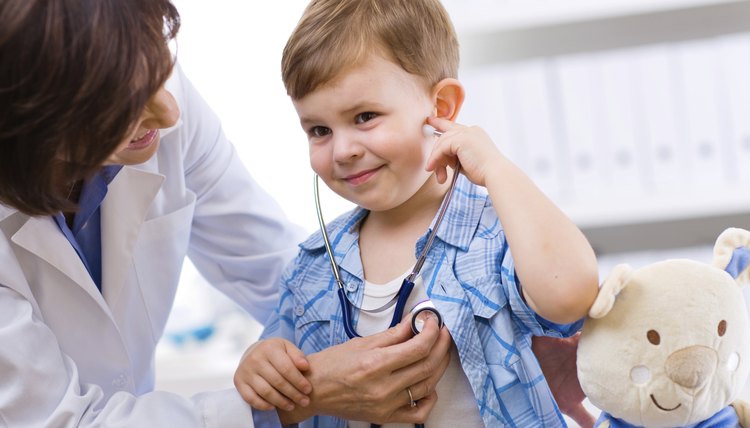 Doctor examining child