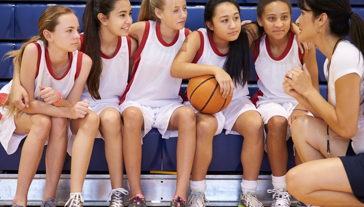 Coach Of Female High School Basketball Team Gives Team Talk