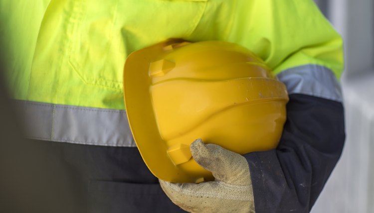 South Africa, Cape Town, Builder holding hard hat