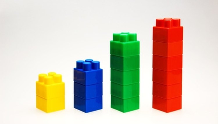 Manipulatives such as stacking blocks can introduce children to mathematical concepts.