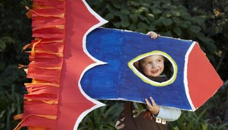 Use cardboard cutouts to create a rocket.