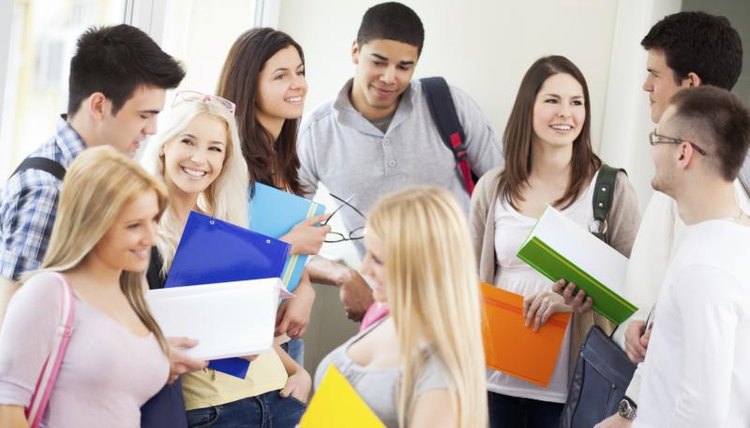 Image of college students talking in the hall.