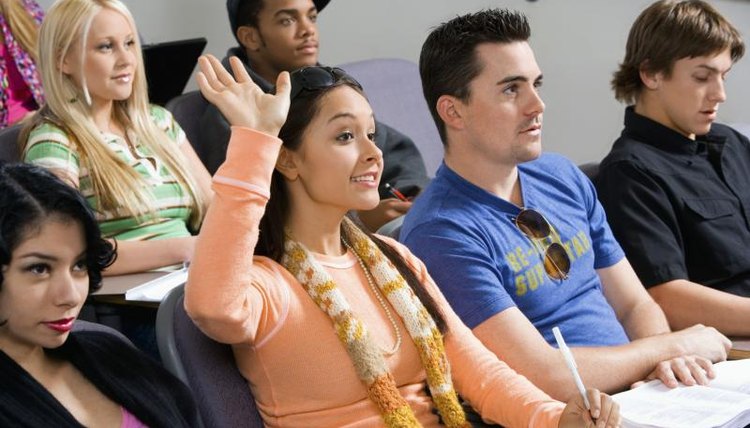 Student raising hand during lecture