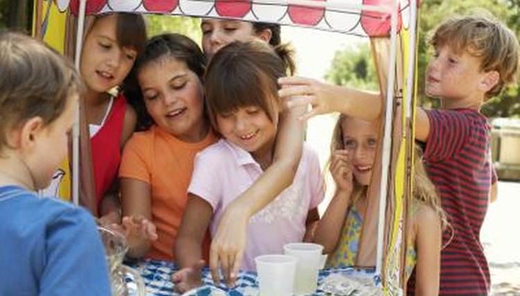 A mobile lemonade stand with lots of customers.