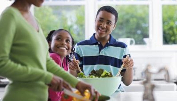 Woman in kitchen with children