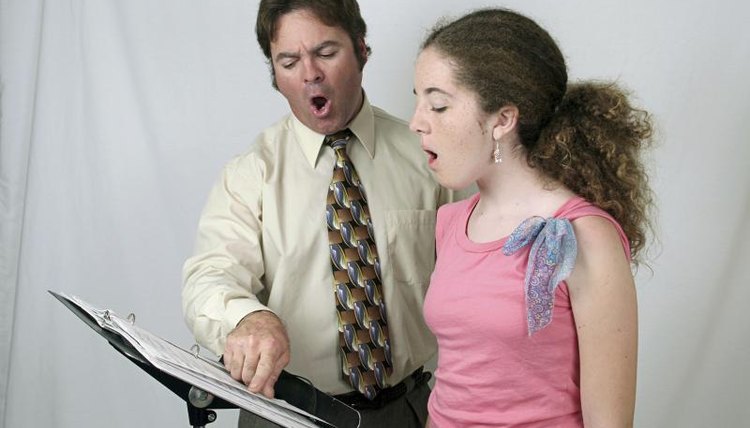 A performing arts enthusiast practicing with her voice coach.