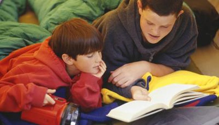 Have parents brings a flashlight and blanket to sit on for Flashlight Reading Night.