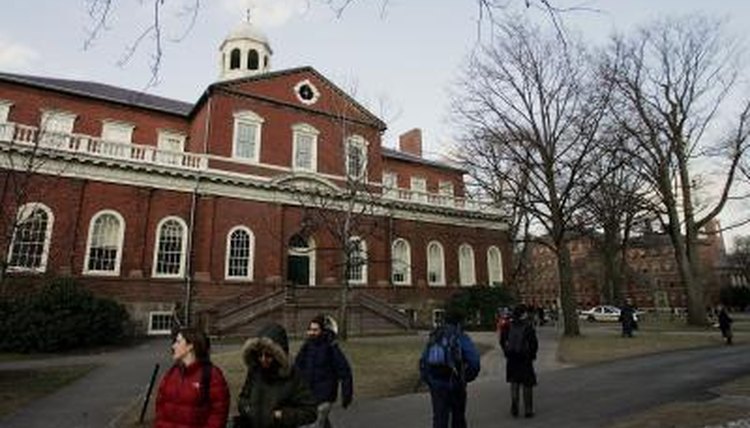 Students walking in front of a building on the Harvard University campus