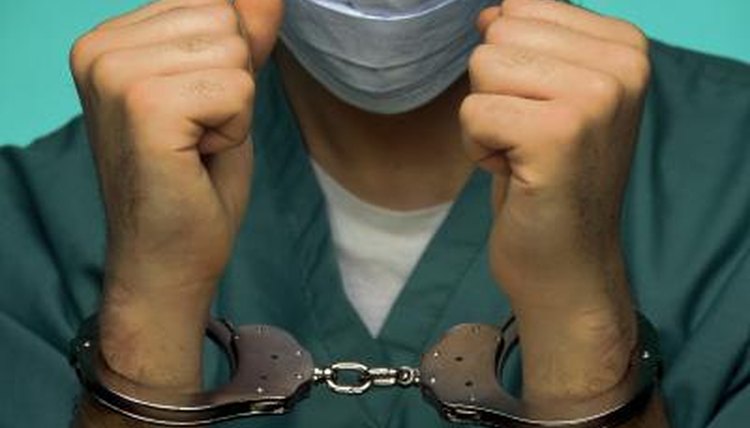 Doctor in handcuffs