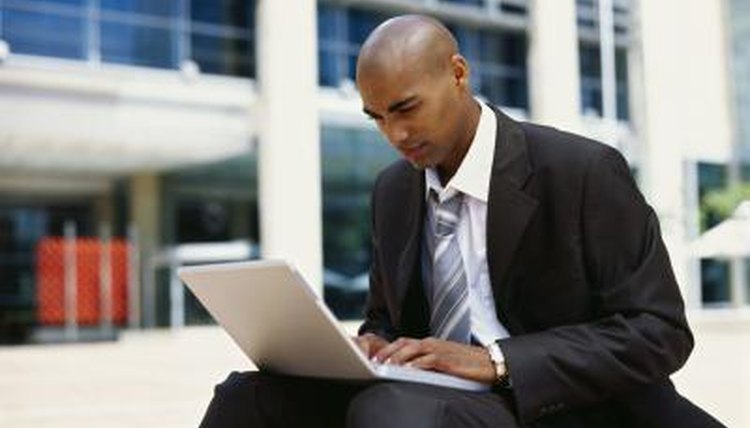Man typing on laptop