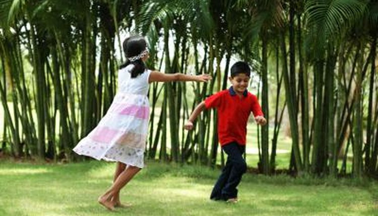 Child running from blind-folded child